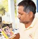 Satish Mishra with a picture of his wife. Mishra threw his daughter out of a ... - article-2106548-11E8F964000005DC-909_468x478