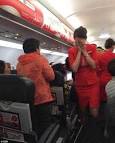 AirAsia flight attendant scalded with hot water and noodles by.