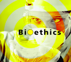 Researcher working on a sample with the text Bioethics showing on the image. Photo