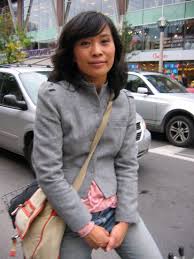 CBC Radio show host and actress Soon-Yin Lee sits on her bicycle ... - 44397fd5ffb897a87ccd6c84c82bcecb