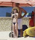 Bikini clad Eliza Dushku looks out to sea but boyfriend Rick Fox