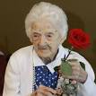 Edna Parker holds a rose that she was given during a birthday party for her ... - 388139_220w