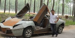 Wang Jian proudly stands next to the homemade Lamborghini Reventon sports car he has built in the Jiangsu province of China - article-2191478-14A25CA0000005DC-741_968x500