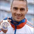 Czech Roman Sebrle collects his gold medal after his dominant display in the ... - _41426529_roman_getty