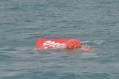 AirAsia flight QZ8501: Crashed planes tail lifted to surface of.