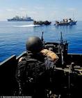 Take that! Royal Marines blow up Somali pirates ammunition-packed.