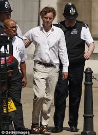 Arrested: David Lawley-Wakelin said he was from the Alternative Iraq Enquiry as he was escorted from the Royal Courts of Justice - article-2151016-1356AEFF000005DC-613_306x423