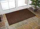 Durable entry door mats with carpet surface and rubber backing.