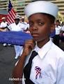 Derrick Wallace, 12, part of a U.S. Navy League Cadet Corps, carries a flag ... - 4th of july 3