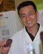 George Wang in his lab with purple sweet potato - George-Wang-potato2