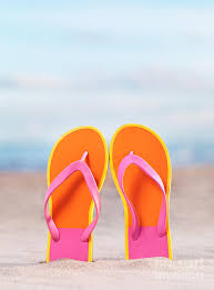 Pair Of Bright Orange Flip Flops At The Beach Photograph by ...