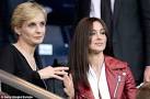Monica Bellucci stands out from the crowd as she watches football.