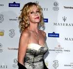 MELANIE GRIFFITH Removes Entire Antonio Heart Tattoo After Split.