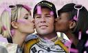 Mark Cavendish is kissed by two girls after winning the ninth stage of Giro ...
