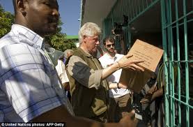 Former Bill Clinton helps load