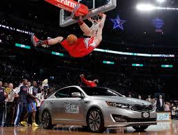 Blake Griffin soars over car