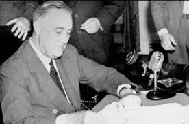 FDR signs the Selective Service Training Act