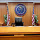 FCC suspends probes of telecommunications firms 