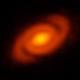 A forming solar system with spiral arms 