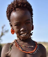 young tribe girl|Young Erbore tribe girl in front of her … – License image – 70137344 ❘  Image Professionals