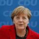Bloodied but unbowed, Merkel sticks to high-stakes migrant policy 