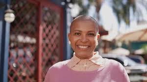 shaved mature outdoor|Mature woman with shaved hair in the city on a rainy day. Barcelona/​​Spain  stock photo