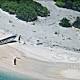 Stranded on a remote Pacific island, they wrote 'SOS' in the sand. Luckily, search crews found them. 
