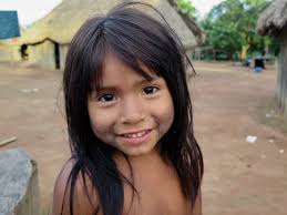 xingu child girl|Resilient Woman and Girls in the TI Xingu in the Brazilian Amazon (2of 3).  Young girl enjoying mandioca pancake and grilled fish and the dog is hoping  for a bite to drop.
