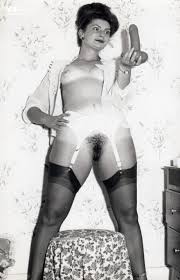 Vintage porn blonde in gold trimmed lingerie and black nylons filmed dildo toying in the hay jpg x Vintage dildo