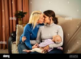 tiny lesbians|Happy lesbian couple with little adopted girl on white background :: Stock  Photography Agency :: Pixel-Shot Studio