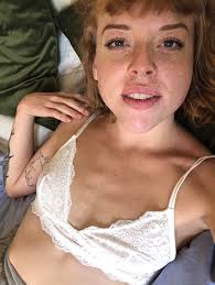 little no tits|A close up of a woman in a short skirt and a bra top - SeaArt AI