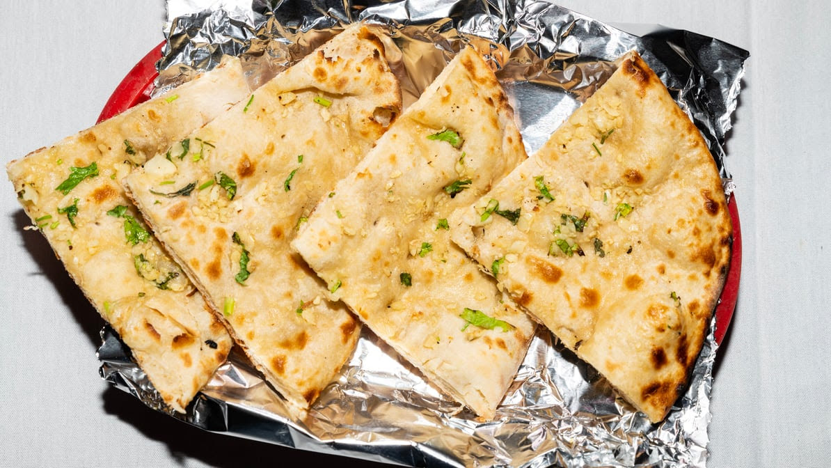 Bombay to Kathmandu Kitchen,Curry Pizza and bar by null