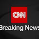 Suspect who shot officer then took off in police car, still on the run 