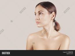 Very young girl nude|A little girl with blond hair against a white wallの写真素材 [69655264] - PIXTA