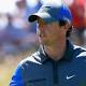 Tiger Woods chases early leader Rory McIlroy at British Open