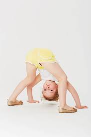 Little girls bent over|