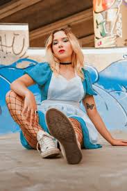 Free photo of edgy blonde woman in blue dress posing confidently jpg x Xxx free young