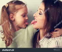 mother daughter tongue|Mother Showing Her Tongue while Making Photo with Daughter Stock Image -  Image of igeneration, love: 141732319