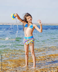 young swimsuit|Young Girl Swimsuit On Shelf By Stock Photo 717152809 | Shutterstock