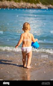 beach little garl|Adorable Little Girls Having Fun At The Beach Photo (259510) -  YouWorkForThem