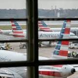 American Airlines earns $476 million on record revenue in 2Q