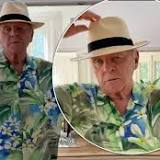 Sir Anthony Hopkins, 84, embraces summer style in a green Hawaiian shirt while showing off his dance moves in light ...