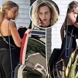 Margot Robbie looks visibly upset as she leaves home of friend Cara Delevingne