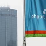 BHP posts record dividends, coy on OZ Min bid