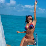Nicole Scherzinger flaunts killer figure in thong bikini dancing with beau Thom Evans