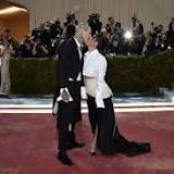 Kanye West heads to the Balenciaga fashion show in NYC while ex-wife Kim Kardashian attends Kourtney's wedding ...