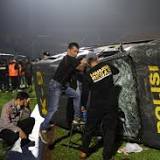 Indonesia football riot: 129 people killed after stampede at match