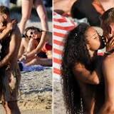 Calvin Harris grabs topless fiancee Vick Hope's bum as they kiss on the beach in Ibiza