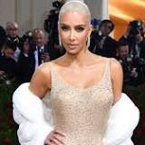 Kim Kardashian flaunts famous curves wearing bikini and boots in racy new video