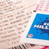 A lucky ticket-holder comes forward to claim staggering £55000000 EuroMillions jackpot